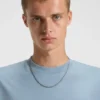 All-Gender-T-Shirt mit verwischtem Logo