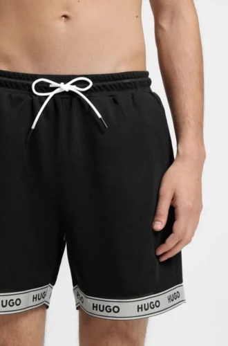 Badeshorts aus Mesh mit Jacquard-Logo-Band