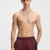 Badeshorts mit vertikalem Logo-Print