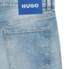Blaue, konisch geschnittene Jeans aus Distressed-Denim Blaue, konisch geschnittene Jeans aus Distressed-Denim