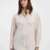 Bluse in Oversize-Passform aus gestreifter Baumwolle