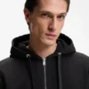 Hoodie aus Baumwollfrottee mit Reißverschluss und charakteristischen Streifenbesätzen
