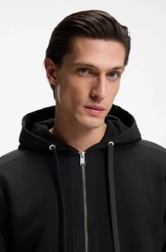Hoodie aus Baumwollfrottee mit Reißverschluss und charakteristischen Streifenbesätzen