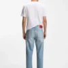 Jeans in lockerer, konisch zulaufender Passform aus hellblauem Denim Jeans in lockerer, konisch zulaufender Passform aus hellblauem Denim