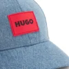 Kinder-Cap mit Logo-Applikation aus Baumwoll-Denim Kinder-Cap mit Logo-Applikation aus Baumwoll-Denim