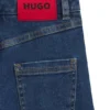 Kinderjeans mit weitem Bein aus blauem Denim Kinderjeans mit weitem Bein aus blauem Denim
