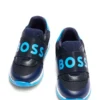 Kindersneaker aus Leder und Mesh mit Markenriemen