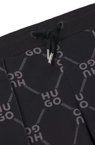 Locker sitzende Trainingshose für Kinder mit gestapeltem Logo-Print