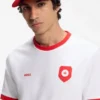 Logo-Cap aus glänzendem Twill mit Abzeichen in Nationalfarben Logo-Cap aus glänzendem Twill mit Abzeichen in Nationalfarben