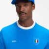 Logo-Cap aus glänzendem Twill mit Abzeichen in Nationalfarben Logo-Cap aus glänzendem Twill mit Abzeichen in Nationalfarben