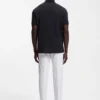 Poloshirt mit gerahmtem Reißverschluss aus Waffel-Jacquard Poloshirt mit gerahmtem Reißverschluss aus Waffel-Jacquard