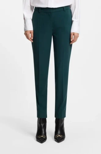 Schmal geschnittene Hose mit geschlitzten Säumen