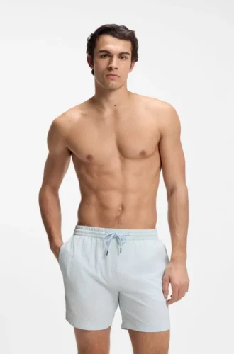 Schnelltrocknende Badeshorts aus Stretch-Seersucker