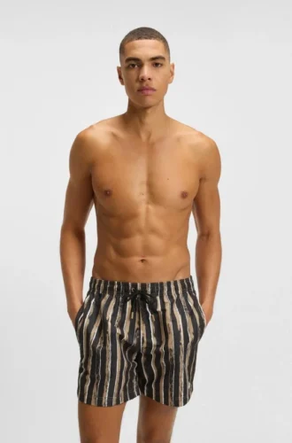 Schnelltrocknende Badeshorts mit Allover-Print