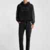 Schwarze Jeans mit schmal zulaufender Passform aus Denim mit Narbeneffekt