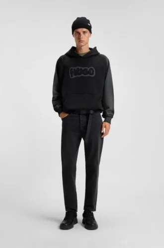 Schwarze Jeans mit schmal zulaufender Passform aus Denim mit Narbeneffekt