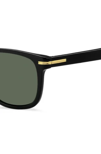 Sonnenbrille aus schwarzem Acetat mit goldfarbenen Metallbeschlägen