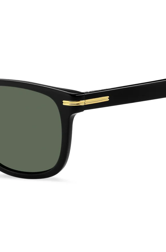 Sonnenbrille aus schwarzem Acetat mit goldfarbenen Metallbeschlägen Sonnenbrille aus schwarzem Acetat mit goldfarbenen Metallbeschlägen