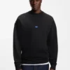 Sweatshirt aus Baumwollfrottee mit blauem Logo-Aufnäher