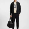 Sweatshirt mit Reißverschluss und Streifendetails aus einer Baumwollmischung Sweatshirt mit Reißverschluss und Streifendetails aus einer Baumwollmischung