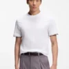 T-Shirt aus Baumwolljersey mit charakteristischen gestreiften Ärmelbündchen T-Shirt aus Baumwolljersey mit charakteristischen gestreiften Ärmelbündchen