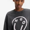 T-Shirt aus Baumwolljersey mit „Happy HUGO“-Print im Melted-Effekt