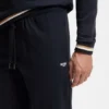 Trainingshose aus Baumwollfrottee mit charakteristischen Streifen und Logo Trainingshose aus Baumwollfrottee mit charakteristischen Streifen und Logo