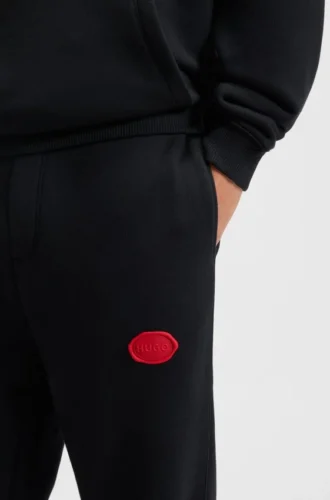 Trainingshose aus Baumwollmischung mit gewachstem Logo
