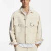 Truckerjacke in lockerer Passform aus ecrufarbenem Denim